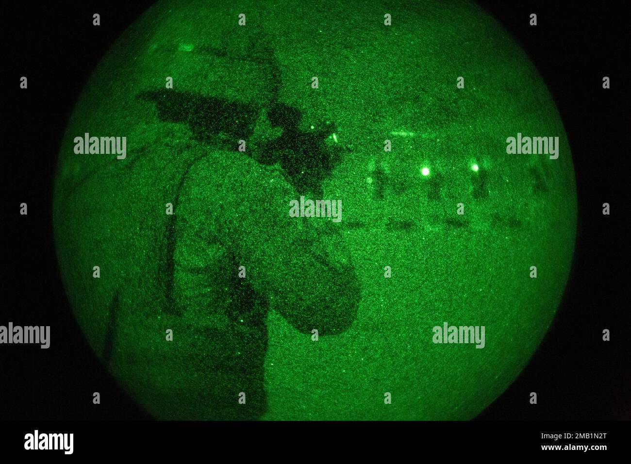 A U.S. Marine with the 13th Marine Expeditionary Unit, uses a PVS-14 Night Vision Monocular device to locate and fire at targets for rifle qualification tables 3-6 during Realistic Urban Training exercise at Marine Corp Air Ground Combat Center Twentynine Palms on June 9, 2022. The 13th MEU is currently conducting RUT exercise to enhance the integration and collective capability of the MEU’s command, air, ground, and logistics elements and prepare the 13th MEU to meet the nation’s crisis response needs during their upcoming overseas deployment. Stock Photo