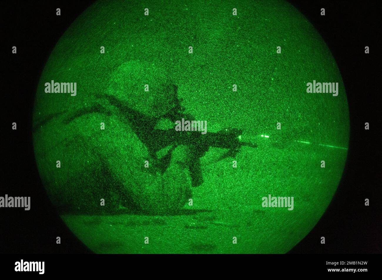A U.S. Marine with the 13th Marine Expeditionary Unit, uses a PVS-14 Night Vision Monocular device to locate and fire at targets for rifle qualification tables 3-6 during Realistic Urban Training exercise at Marine Corp Air Ground Combat Center Twentynine Palms on June 9, 2022. The 13th MEU is currently conducting RUT exercise to enhance the integration and collective capability of the MEU’s command, air, ground, and logistics elements and prepare the 13th MEU to meet the nation’s crisis response needs during their upcoming overseas deployment. Stock Photo