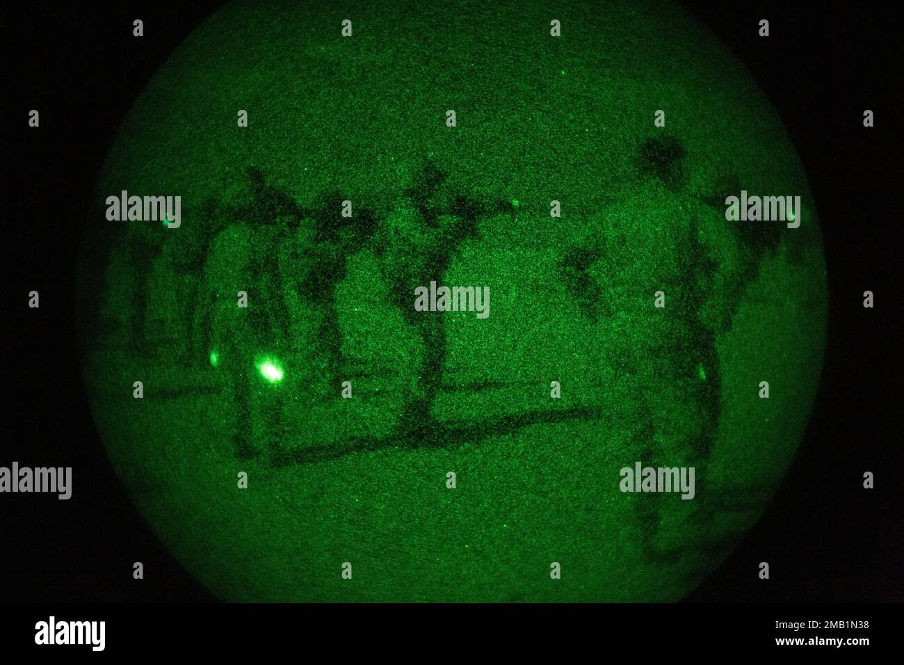 U.S. Marines with the 13th Marine Expeditionary Unit, use a PVS-14 Night Vision Monocular device to locate and fire at targets for rifle qualification tables 3-6 during a Realistic Urban Training exercise at Marine Corp Air Ground Combat Center Twentynine Palms on June 9, 2022. The 13th MEU is currently conducting RUT exercise to enhance the integration and collective capability of the MEU’s command, air, ground, and logistics elements and prepare the 13th MEU to meet the nation’s crisis response needs during their upcoming overseas deployment. Stock Photo