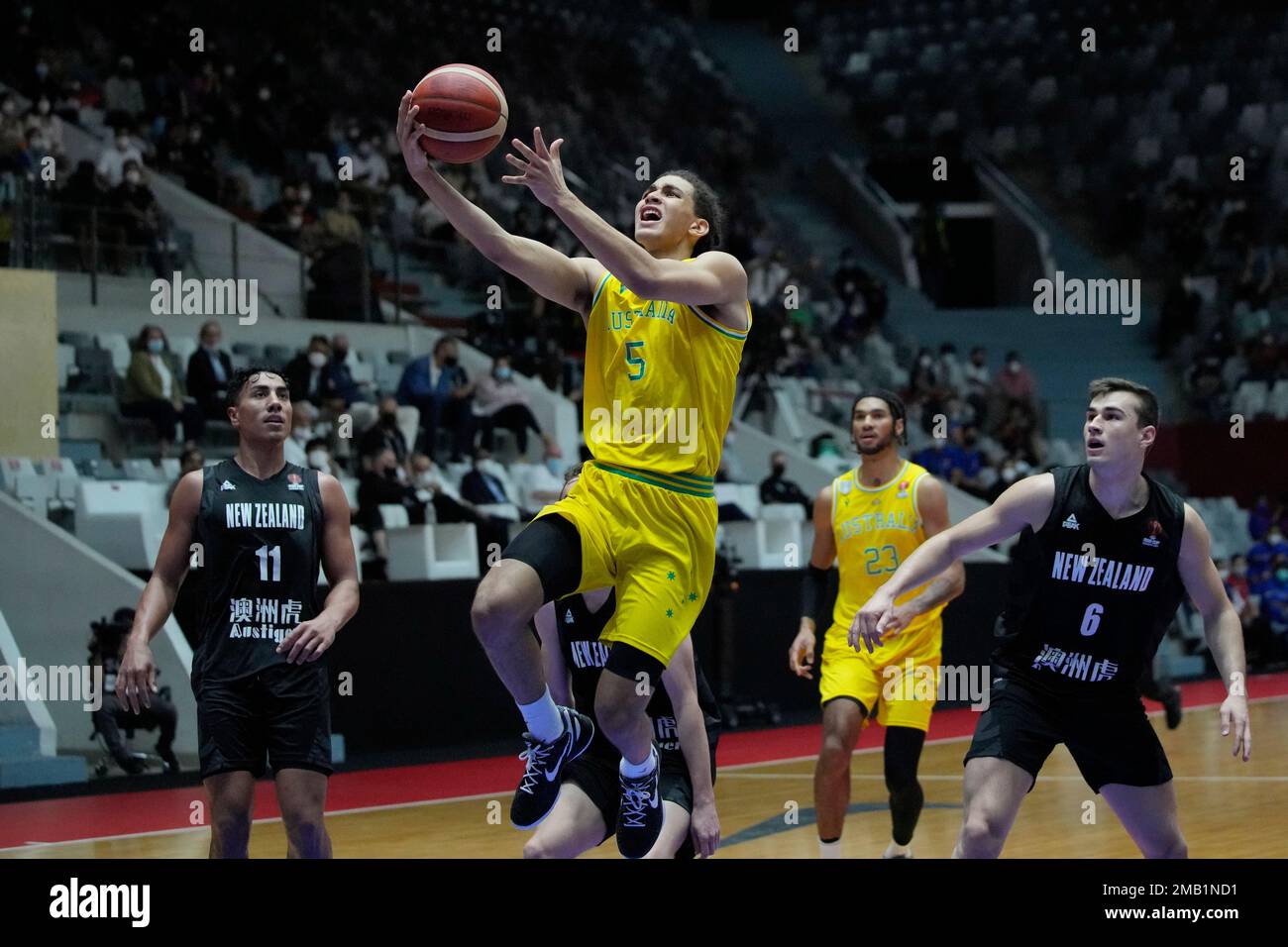 Australia's Tyrese Proctor makes a lay up against New Zealand's Taine ...