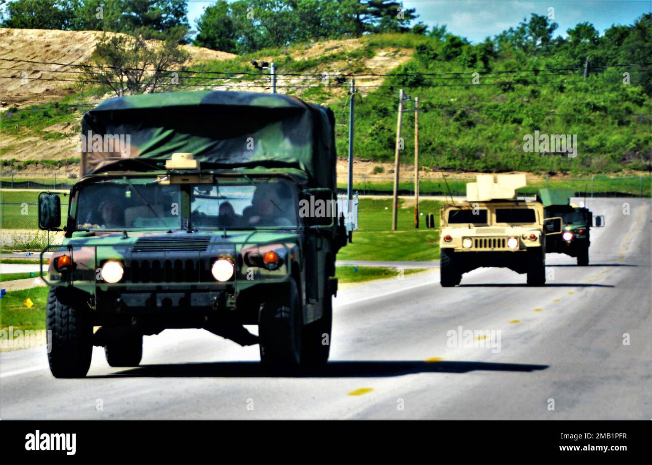 Service members at the installation for training drive military vehicles on post June 9, 2022, at Fort McCoy, Wis. Annually, tens of thousands of troops complete institutional and transient troop training operations at Fort McCoy. During June 2022, thousands of troops also trained at Fort McCoy, including troops from the Wisconsin National Guard and Iowa National Guard. Stock Photo