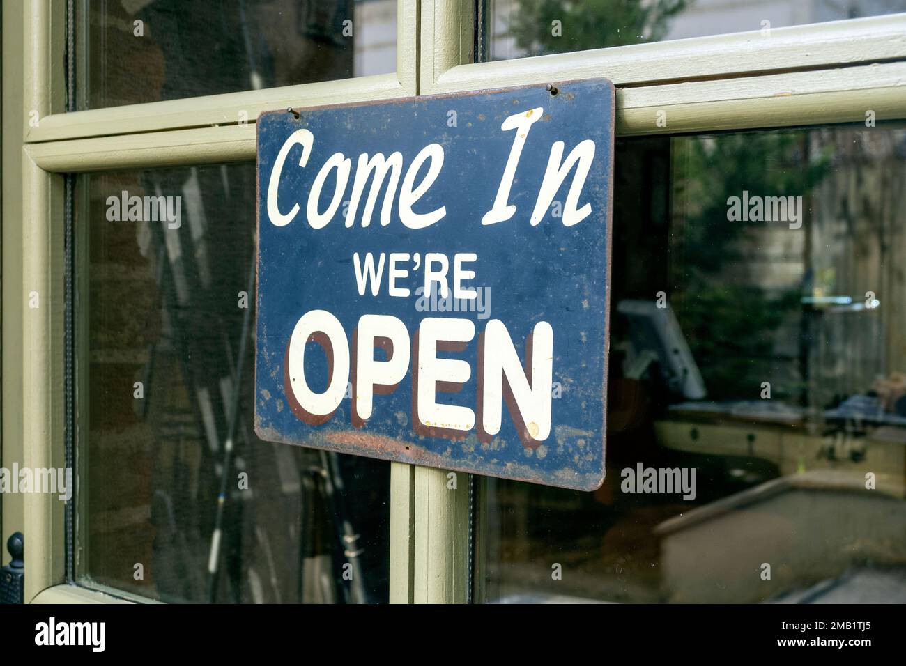 Come in we are open - text on a sign board of cafe Stock Photo