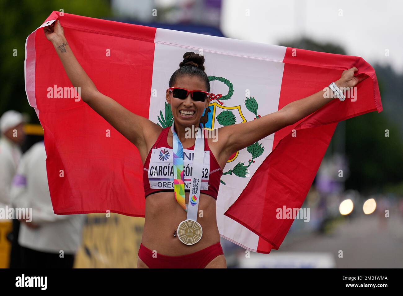 Kimberly Garcia Leon, of Peru, celebrates after winning the women's 35km race walk at the World