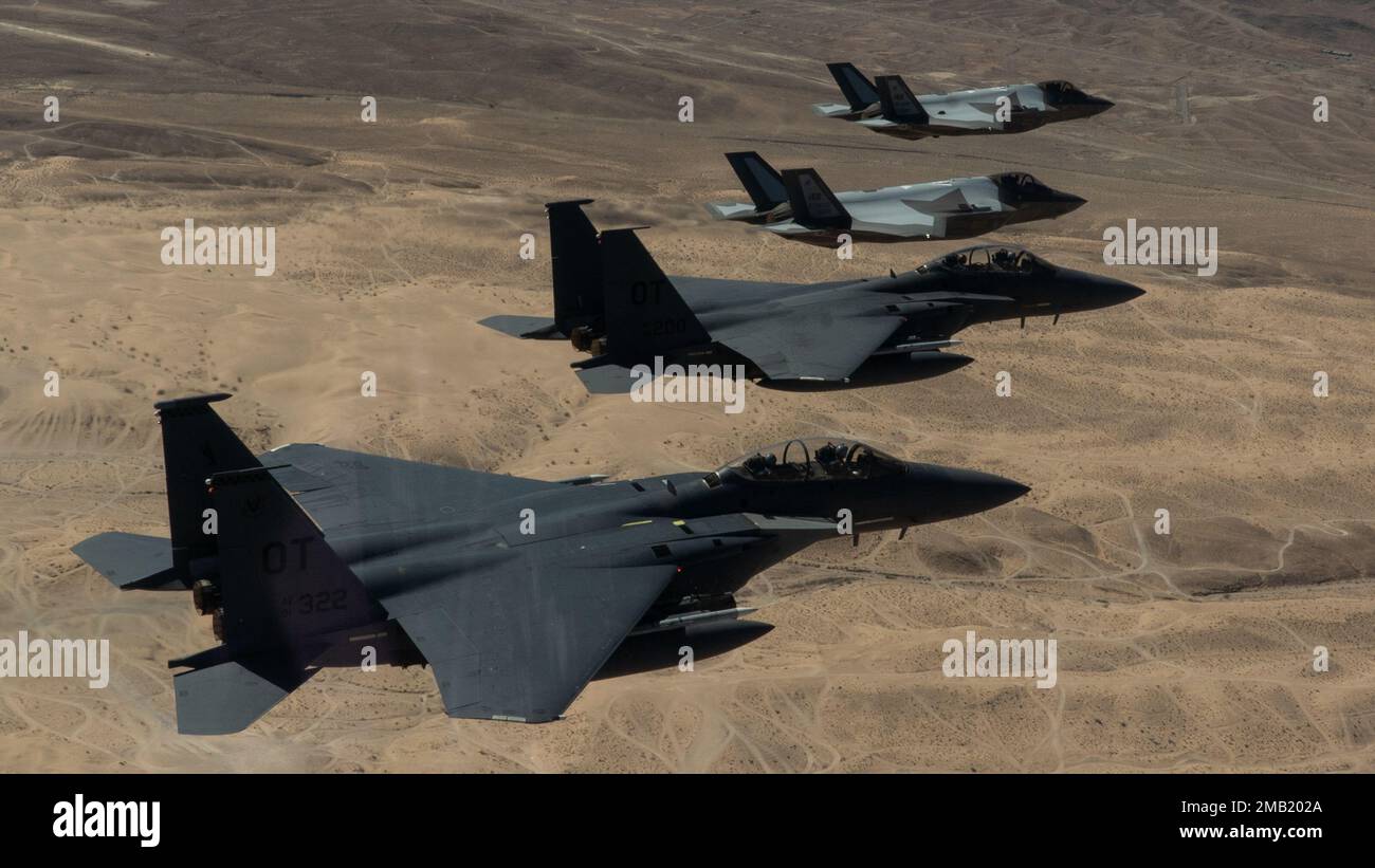 Two F-35A Lightning IIs and two F-15E Strike Eagles fly in a formation ...