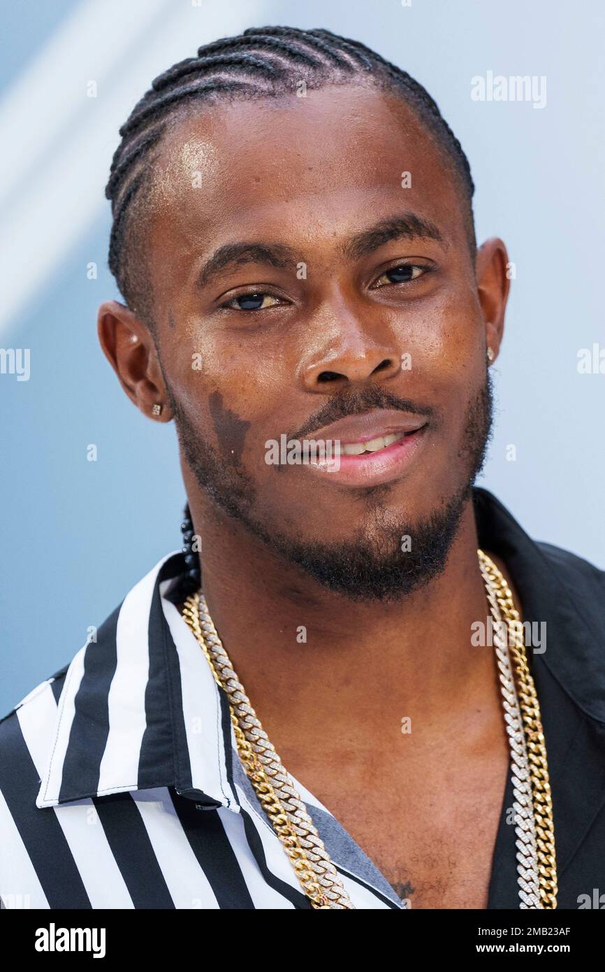 Jofra Archer poses for photographers upon arrival for the premiere of