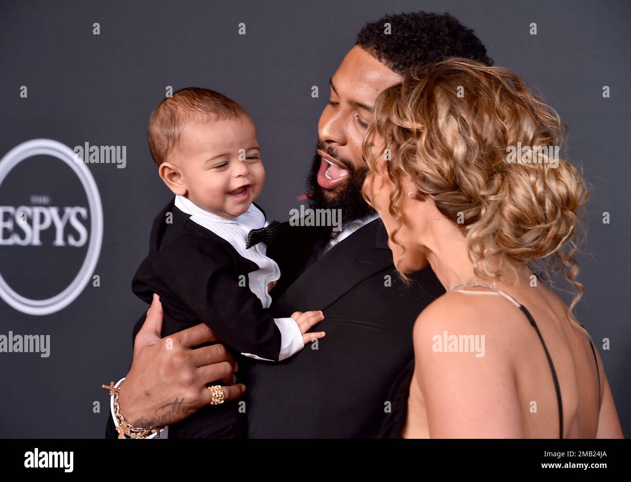 Odell Beckham Jr., left, and Lauren Wood arrive with child Zydn Beckham