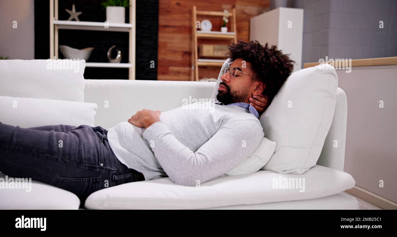 Sofa man sleep hires stock photography and images Alamy