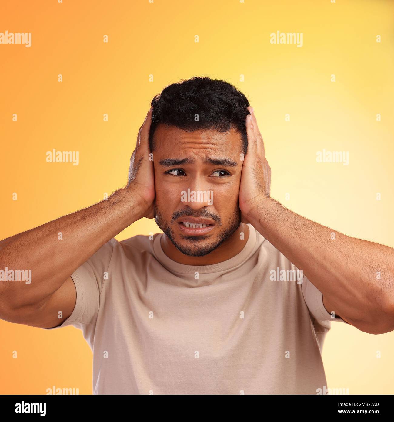 Scared, loud and man worried by his stress and covering his ears in