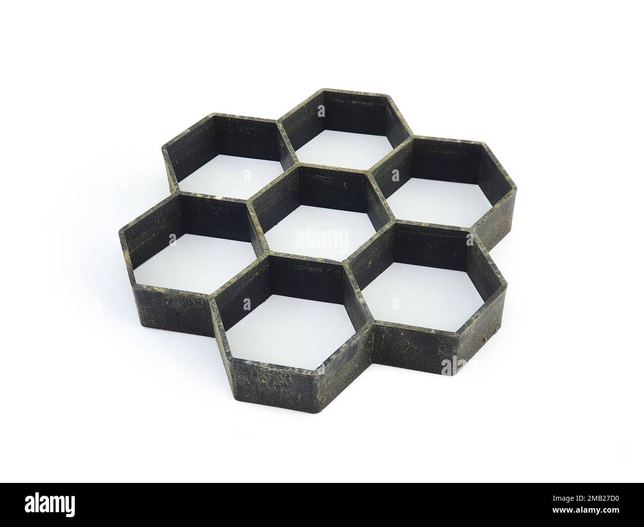 Form for making paving hexagon tiles, honeycomb tiles isolated on white ...