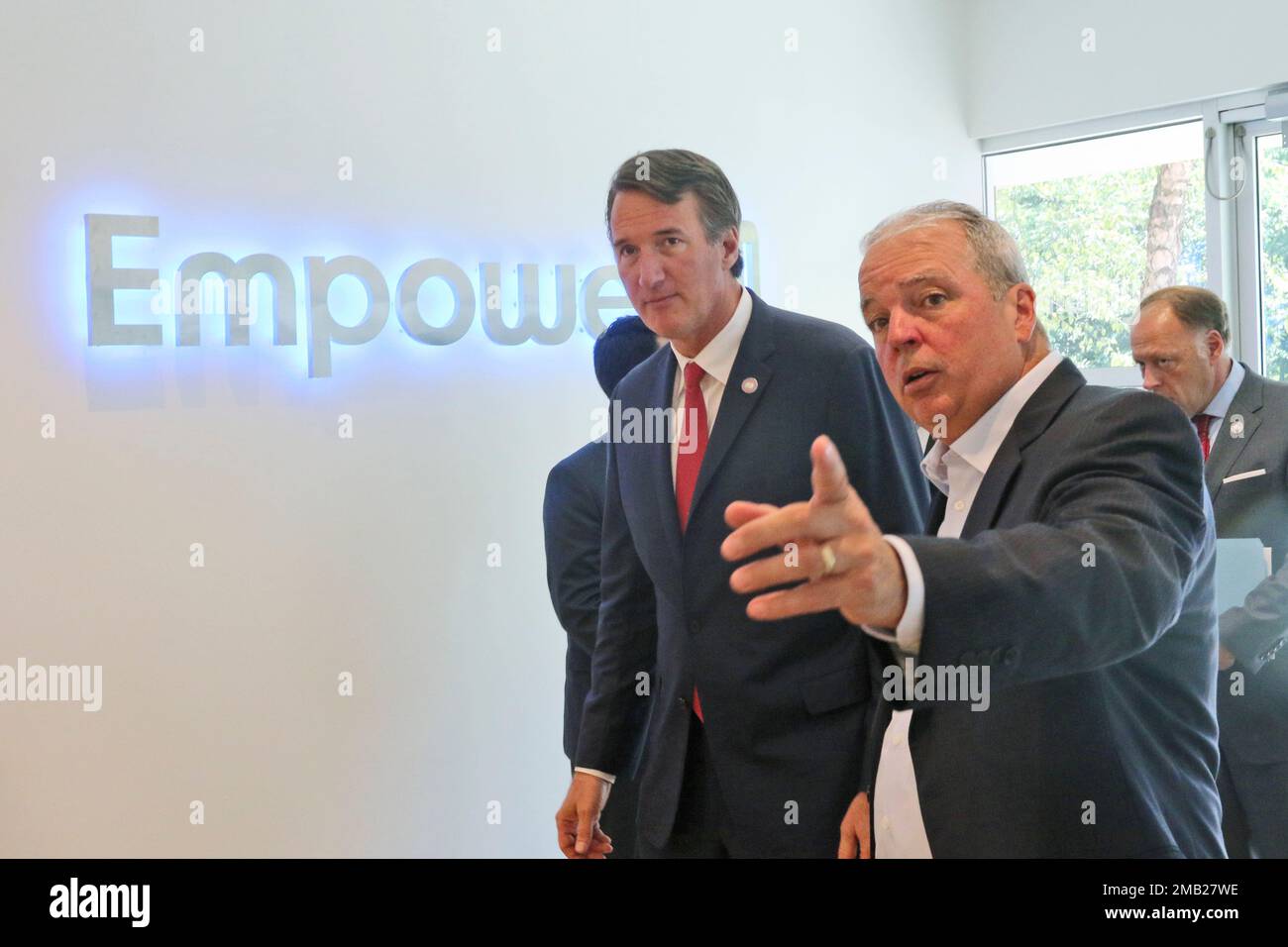 Empower AI CEO Paul Dillahay, right, welcomes Virginia Gov. Glenn ...