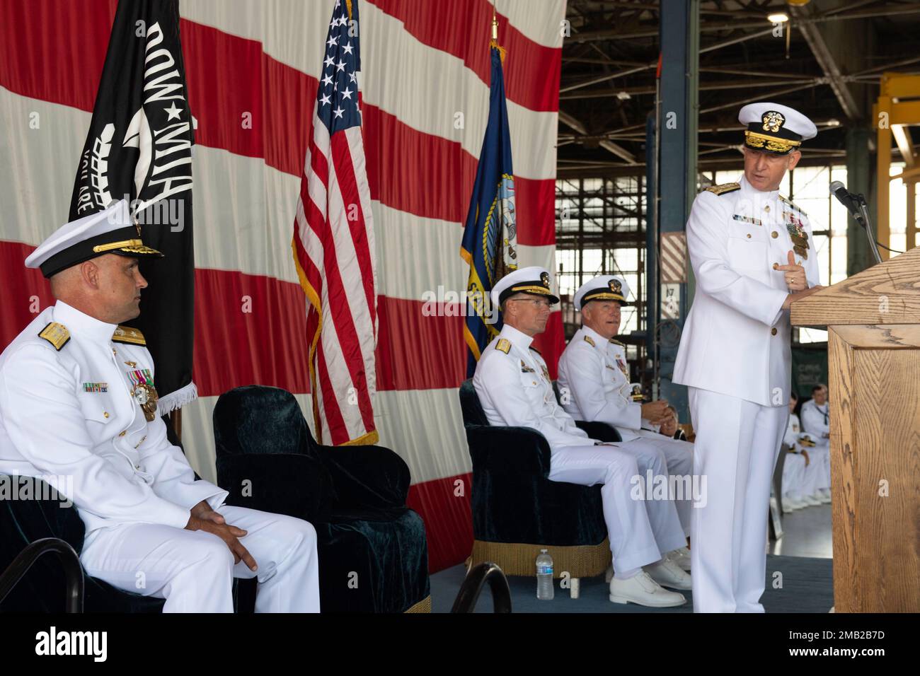 SAN DIEGO (Jun. 10, 2022) - Chief of Navy Reserve Vice Adm. John Mustin addresses Rear Adm. Brad Dunham, incoming Commander, Naval Air Force Reserve (CNAFR), while speaking as the guest of honor for the CNAFR change of command ceremony in the Fleet Logistics Support Squadron (VRC) 30 hangar at Naval Base Coronado, Jun. 10. CNAFR mans, trains and equips the Naval Air Force Reserve in order to provide enduring operational support and strategic depth to Navy forces that win in combat. Stock Photo