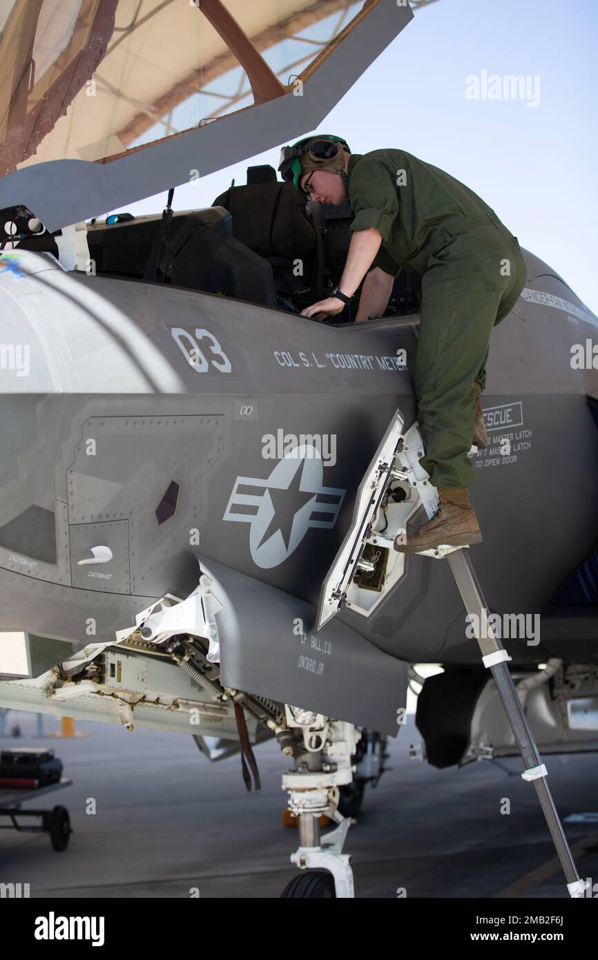 U.S. Marine Corps Lance Cpl. Lukasz Lewandoski, a fixed-wing aircraft safety mechanic with Marine Fighter Attack Squadron (VMFA) 122, 13th Marine Expeditionary Unit, inspects the cockpit of an F-35B Lightning II during Realistic Urban Training exercise at Marine Corps Air Station Yuma, Arizona, June 9, 2022. The purpose of RUT is to enhance the integration and collective capability of the MEU's command, air, ground, and logistics elements and prepare the 13th MEU to meet the nation's crisis response needs during its upcoming overseas deployment. Stock Photo