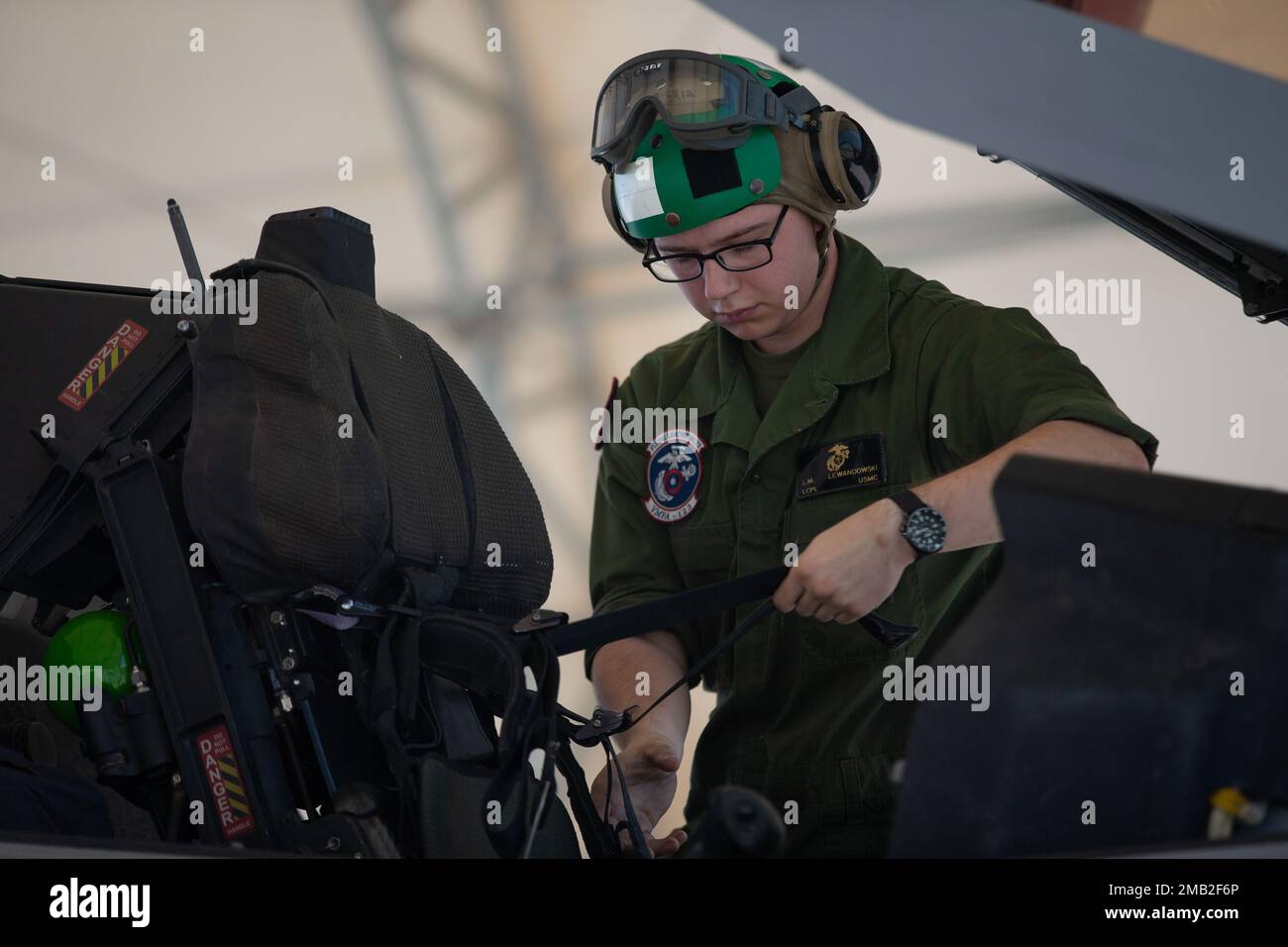 U.S. Marine Corps Lance Cpl. Lukasz Lewandoski, a fixed-wing aircraft safety mechanic with Marine Fighter Attack Squadron (VMFA) 122, 13th Marine Expeditionary Unit, inspects the seat of an F-35B Lightning II during Realistic Urban Training exercise at Marine Corps Air Station Yuma, Arizona, June 9, 2022. The purpose of RUT is to enhance the integration and collective capability of the MEU's command, air, ground, and logistics elements and prepare the 13th MEU to meet the nation's crisis response needs during its upcoming overseas deployment. Stock Photo