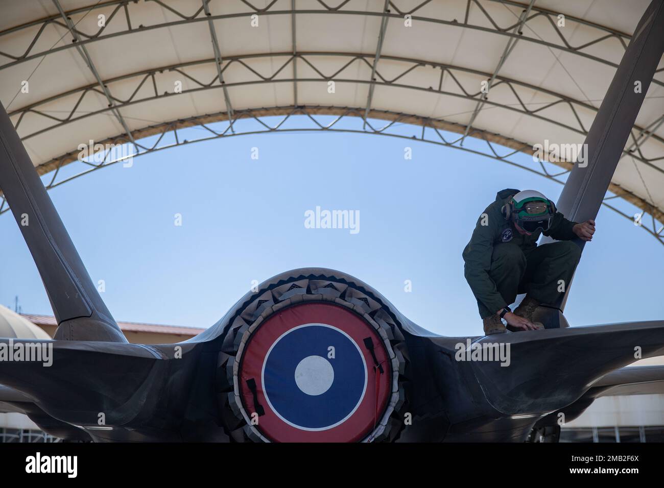 U.S. Marine Corps Lance Cpl. Logan Runnells, a fixed-wing aircraft mechanic with Marine Fighter Attack Squadron (VMFA) 122, 13th Marine Expeditionary Unit, inspects the tail of an F-35B Lightning II during Realistic Urban Training exercise at Marine Corps Air Station Yuma, Arizona, June 9, 2022. The purpose of RUT is to enhance the integration and collective capability of the MEU's command, air, ground, and logistics elements and prepare the 13th MEU to meet the nation's crisis response needs during its upcoming overseas deployment. Stock Photo