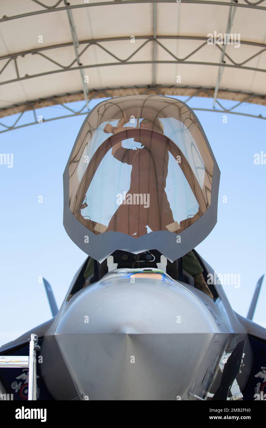U.S. Marine Corps Lance Cpl. Lukasz Lewandoski, a fixed-wing aircraft safety mechanic with Marine Fighter Attack Squadron (VMFA) 122, 13th Marine Expeditionary Unit, inspects the cockpit of an F-35B Lightning II during Realistic Urban Training exercise at Marine Corps Air Station Yuma, Arizona, June 9, 2022. The purpose of RUT is to enhance the integration and collective capability of the MEU's command, air, ground, and logistics elements and prepare the 13th MEU to meet the nation's crisis response needs during its upcoming overseas deployment. Stock Photo