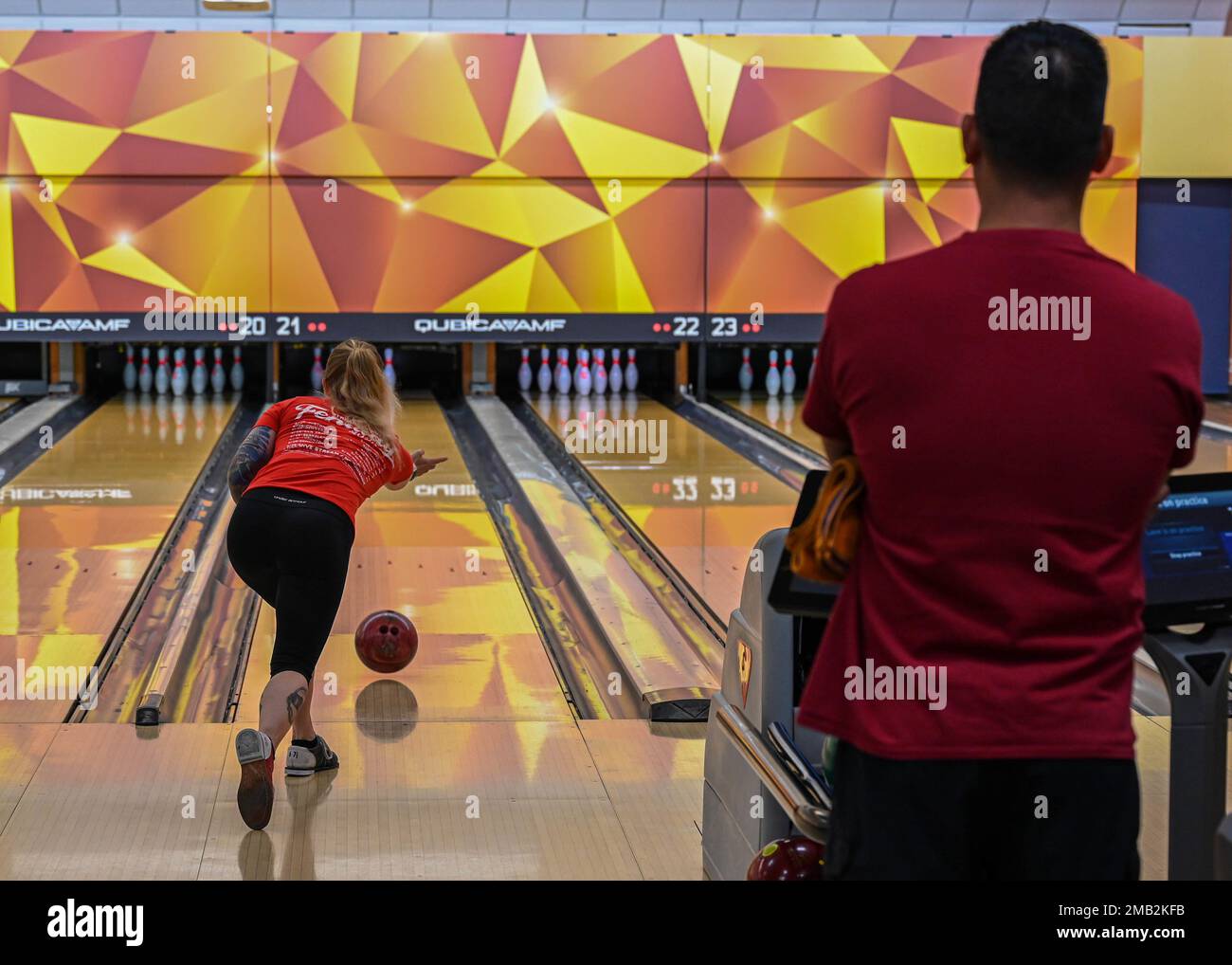 A competitive bowler in the Crossbow Games throws a ball at the Langley