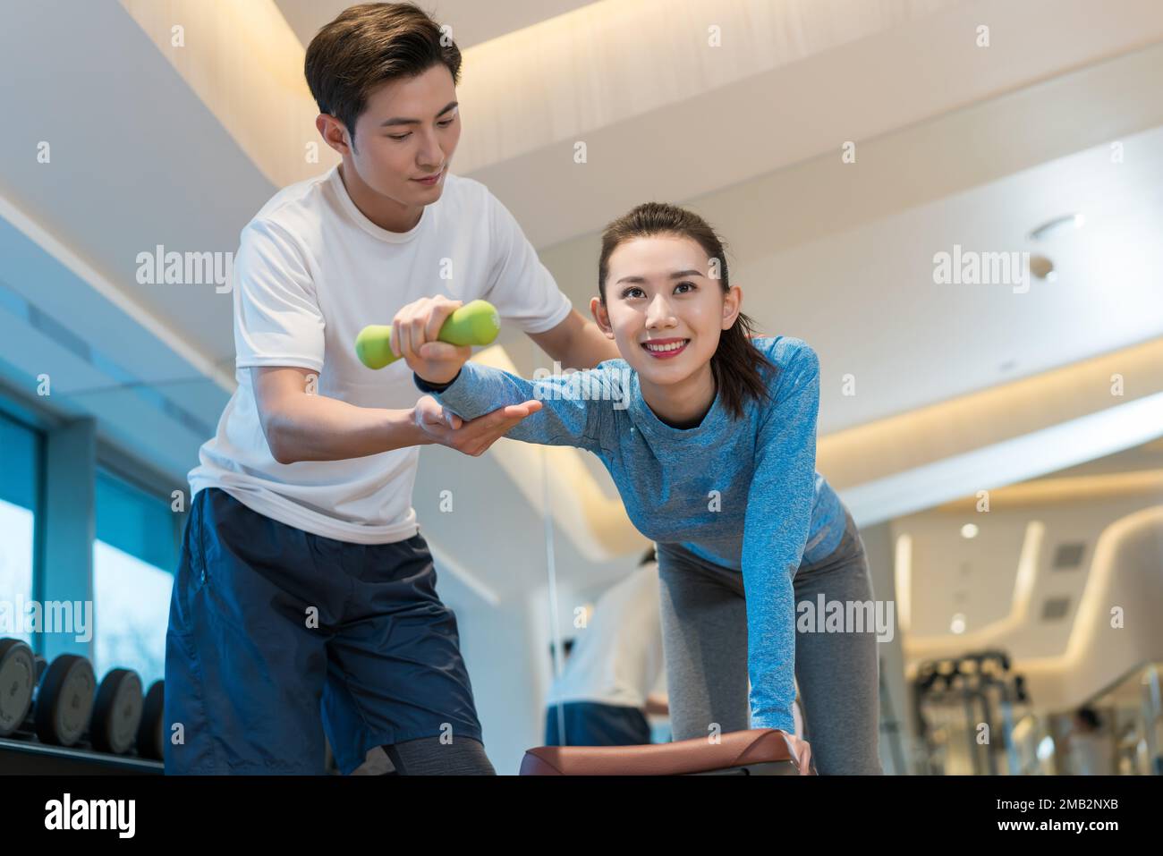 Young woman kneeling in chinese hi-res stock photography and images - Alamy