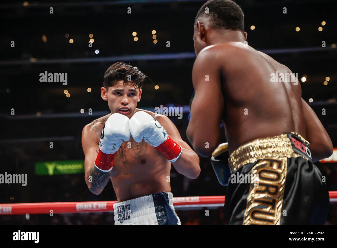 Ryan Garcia, left, and Javier Fortuna exchange punches during a