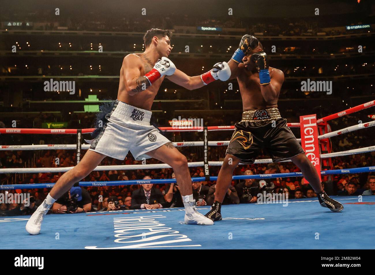 Ryan Garcia, left, and Javier Fortuna exchange punches during a