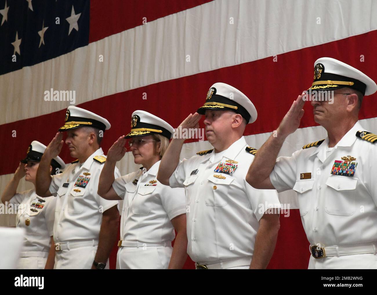 Naval Information Warfighting Development Command (NIWDC) held a change of command ceremony on 10 June.  Rear Adm. Michael J. Vernazza (second from left) was relieved as Commander NIWDC by CAPT Bryan E. Braswell (second from right).  Vice Adm. Kelly A. Aeschbach, Commander, Naval Information Forces (center), was the presiding officer.  Also pictured are CTTCM Kristalina M. Greene (left) and CAPT David B. Thames, Chaplain (right). Stock Photo
