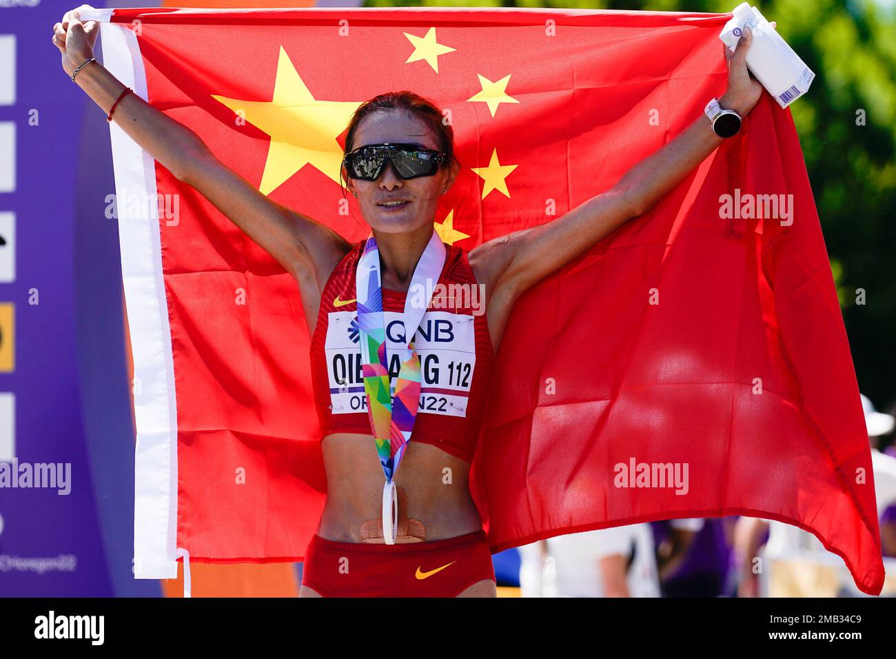 Shijie Qieyang, of China, celebrates her third place finish in the