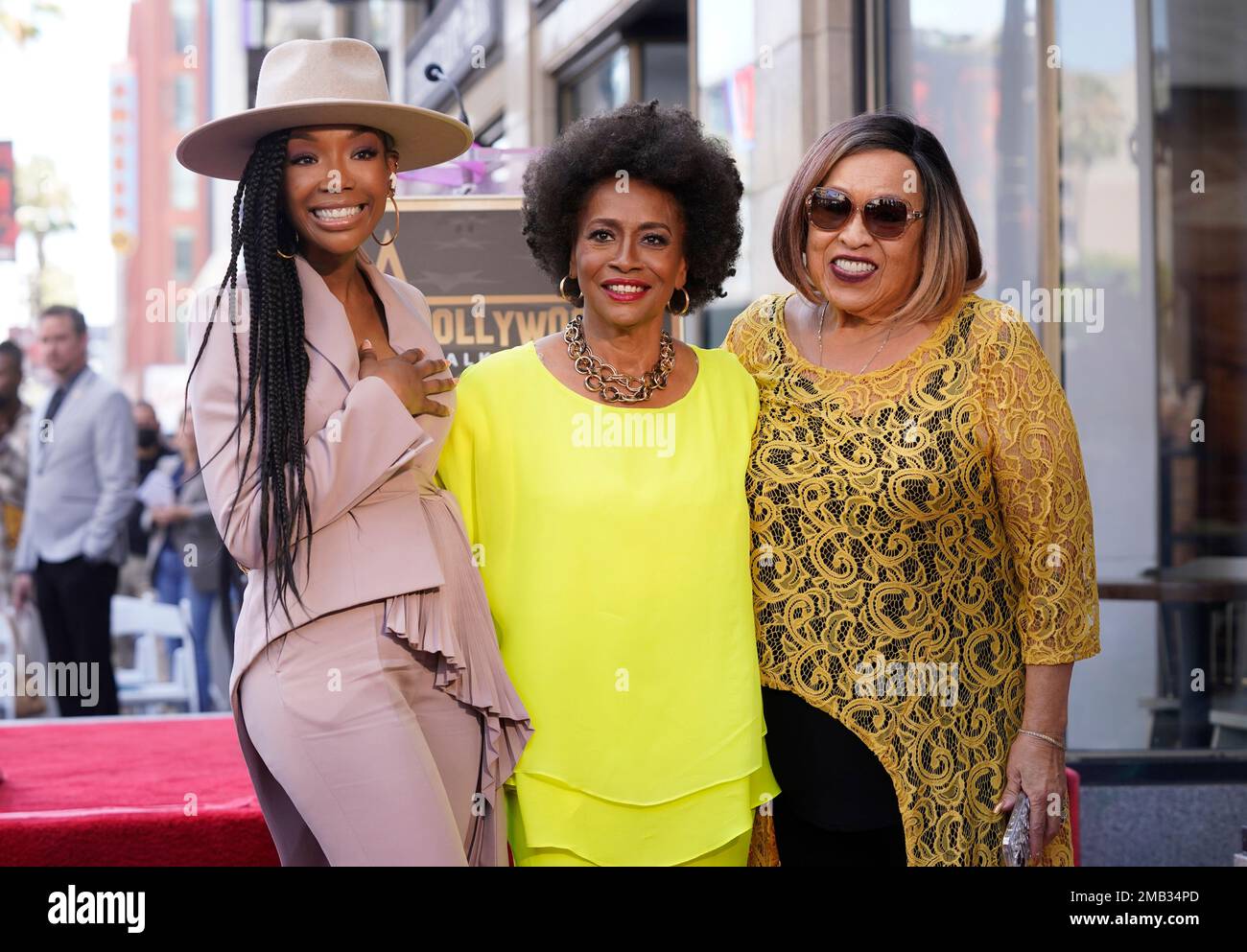 Actor Jenifer Lewis, center, poses with guests Brandy, left, and Roz