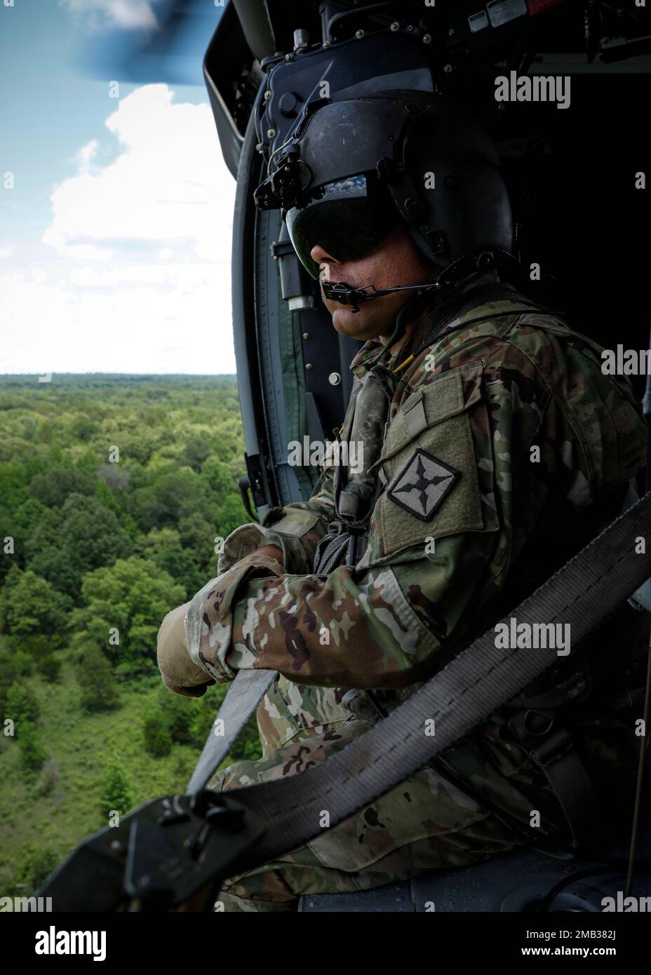The Medical Evacuation Crew from G Company 3-238th General Support Aviation Battalion conducts standard preflight checks before assuming medical evacuation coverage. The crew supports the units participating in annual training by flying over Fort Chaffee checking units' locations, training areas, firing ranges, and potentially hazardous areas; the information gathered is then cross-referenced with their area maps. By conducting these daily flights, the crew can stay prepared to aid during natural disasters or instances where individuals are injured in rural, hard-to-reach areas. Stock Photo