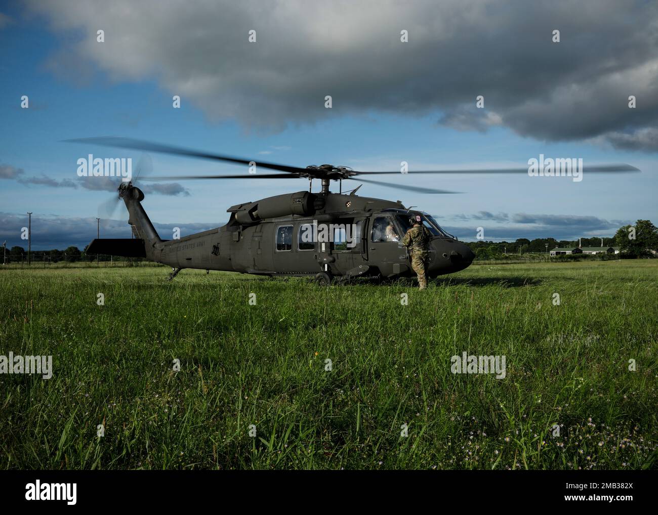 The Medical Evacuation Crew from G Company 3-238th General Support Aviation Battalion conducts standard preflight checks before assuming medical evacuation coverage. The crew supports the units participating in annual training by flying over Fort Chaffee checking units' locations, training areas, firing ranges, and potentially hazardous areas; the information gathered is then cross-referenced with their area maps. By conducting these daily flights, the crew can stay prepared to aid during natural disasters or instances where individuals are injured in rural, hard-to-reach areas. Stock Photo