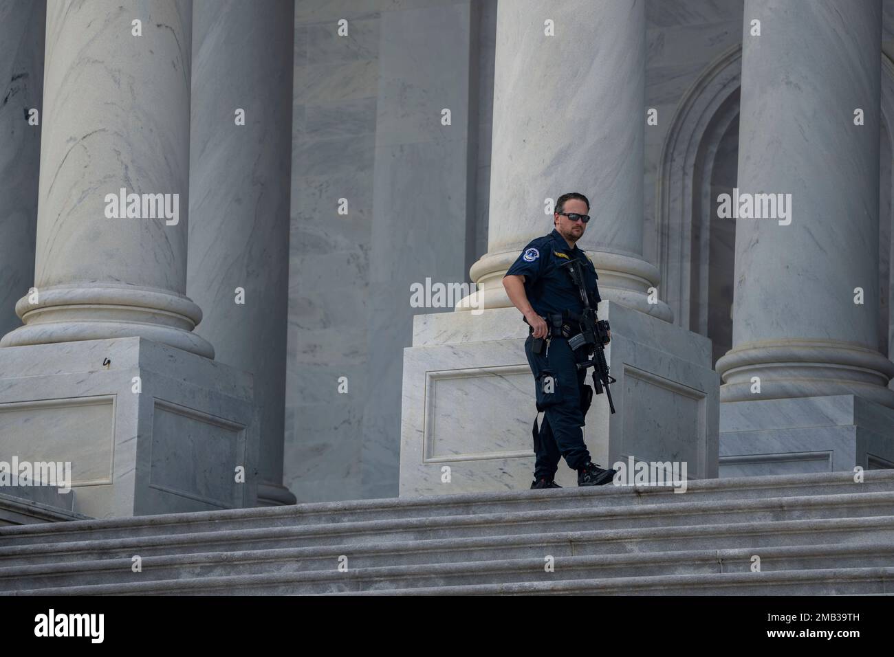 A U.S. Capitol Police officer patrols after the flag-draped casket ...