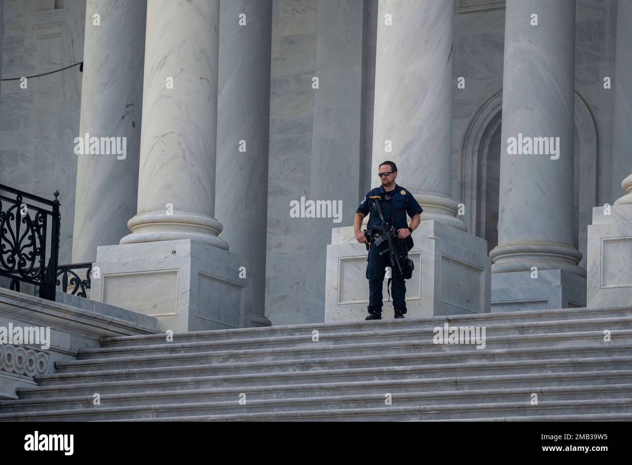 A U.S. Capitol Police officer patrols after the flag-draped casket ...