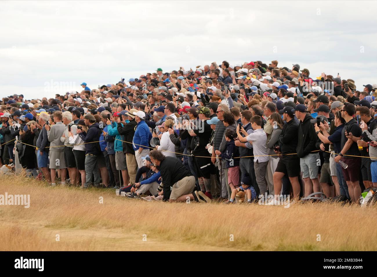 Spectators watch the first round of the British Open golf championship on the Old Course at St