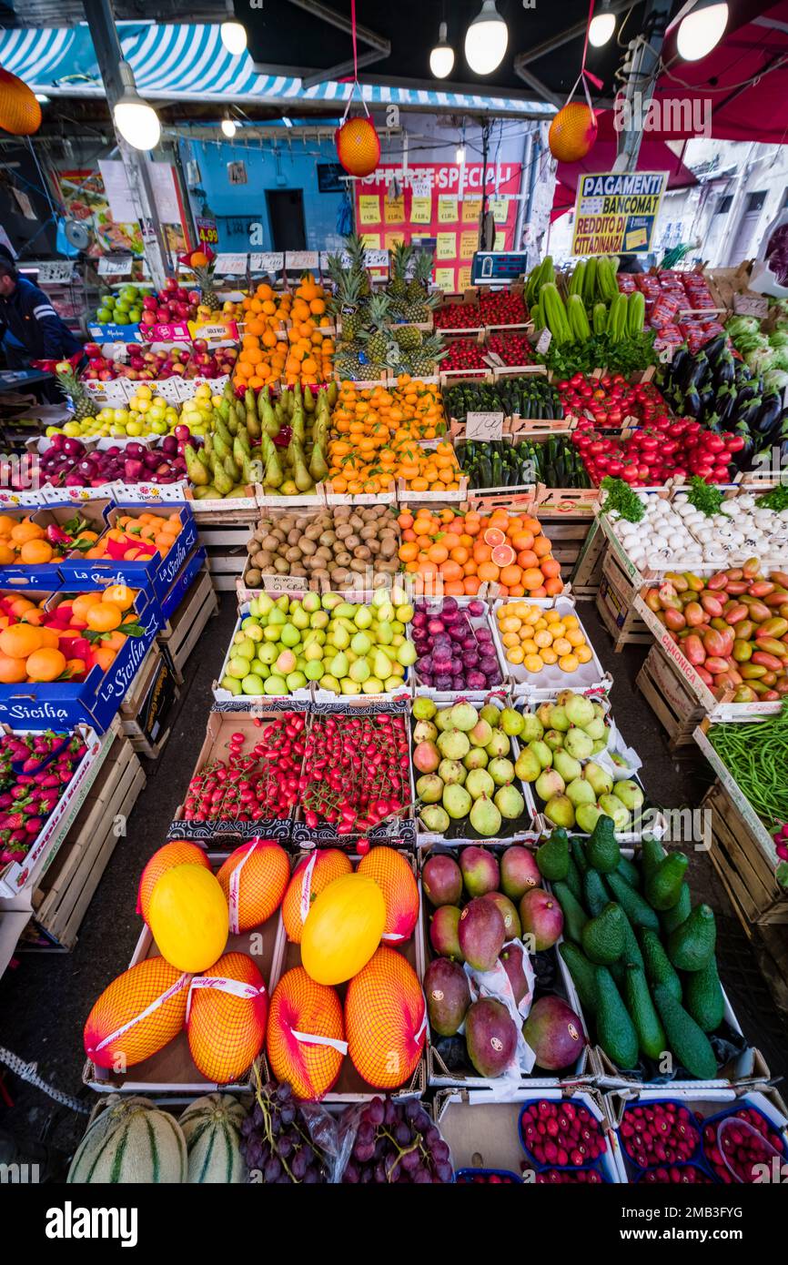 All kinds of fruits and vegetables are displayed for sale in the local Ballaro market. Stock Photo