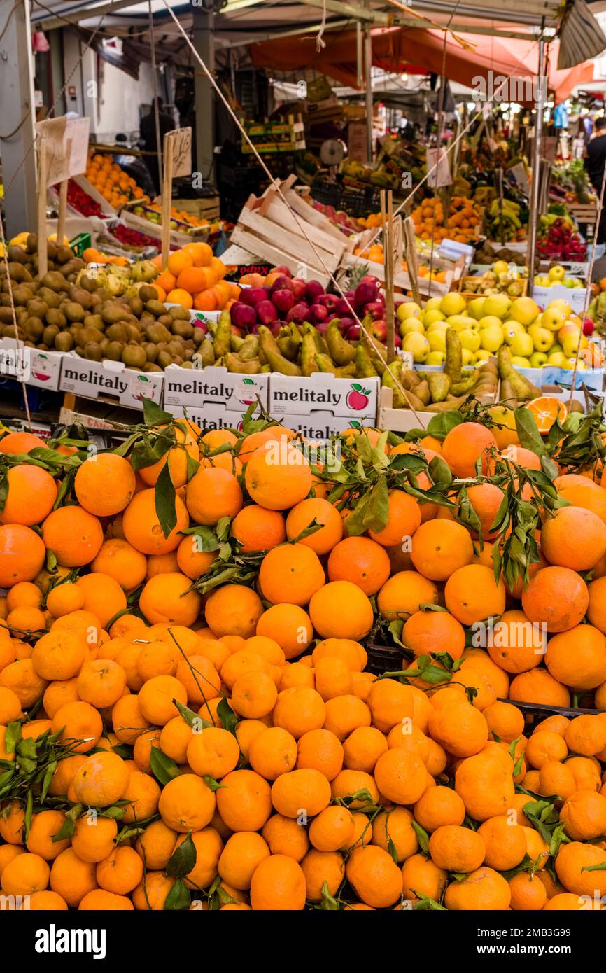 All kinds of fruits and vegetables are displayed for sale in the local Ballaro market. Stock Photo