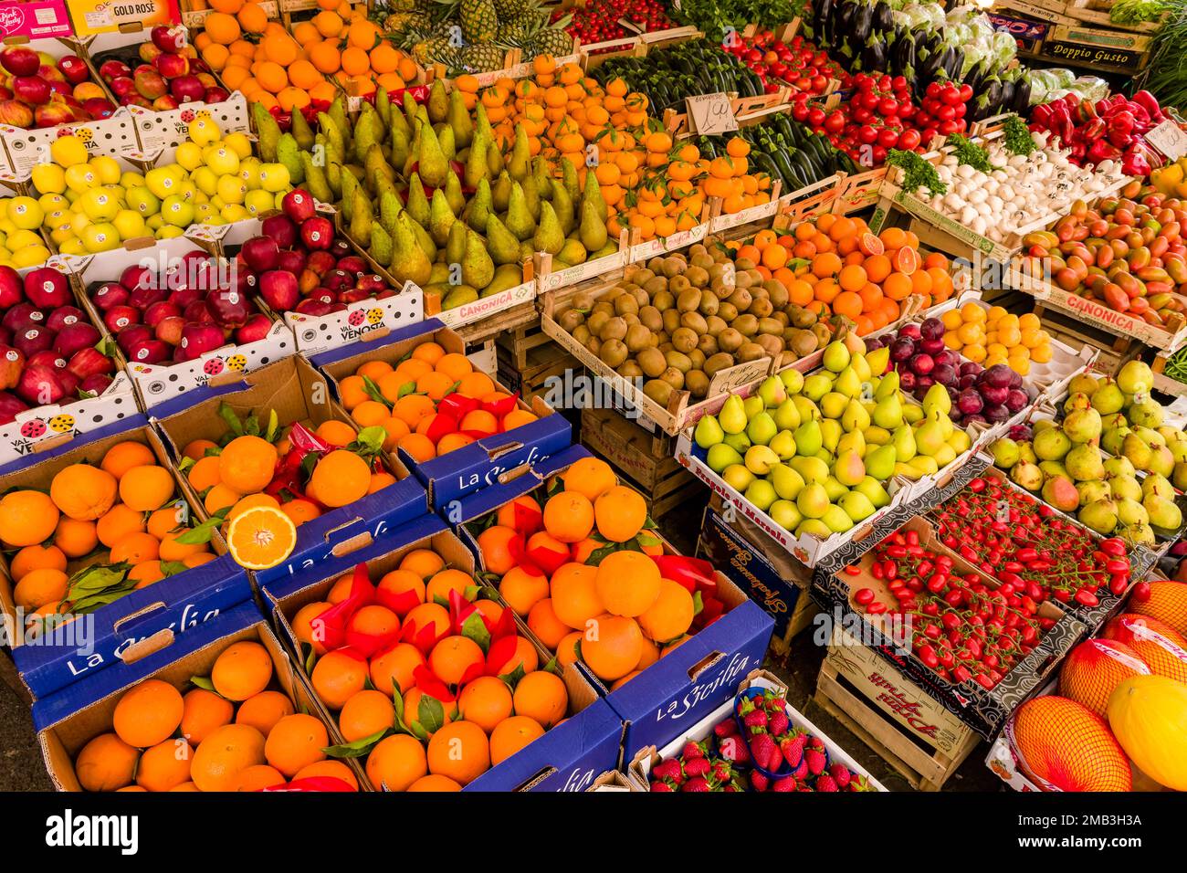 All kinds of fruits and vegetables are displayed for sale in the local Ballaro market. Stock Photo