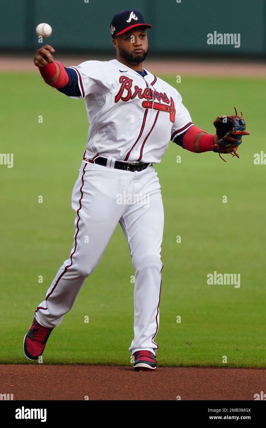 Atlanta Braves second baseman Robinson Cano (22) gets loose before