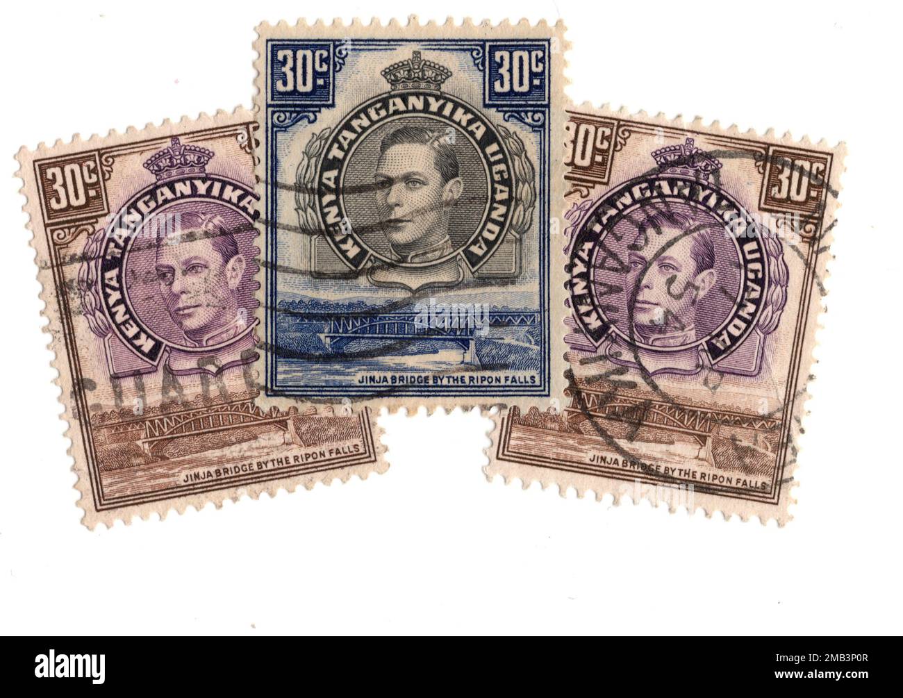 Vintage postage stamps from Kenya, Uganda and Tanganyika on a white