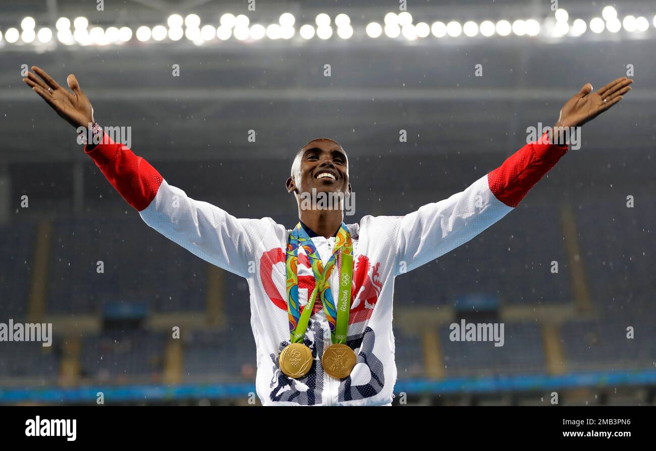 FILE Britain's Mo Farah celebrates winning the gold medal, in the men's