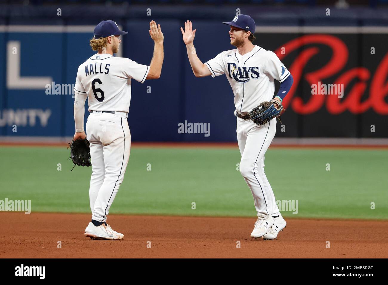 Tampa Bay Rays' Brett Phillips celebrates with teammate Taylor Walls (6)  after defeating the Boston Res Sox in a baseball game Monday, July 11, 2022,  in St. Petersburg, Fla. (AP Photo/Scott Audette