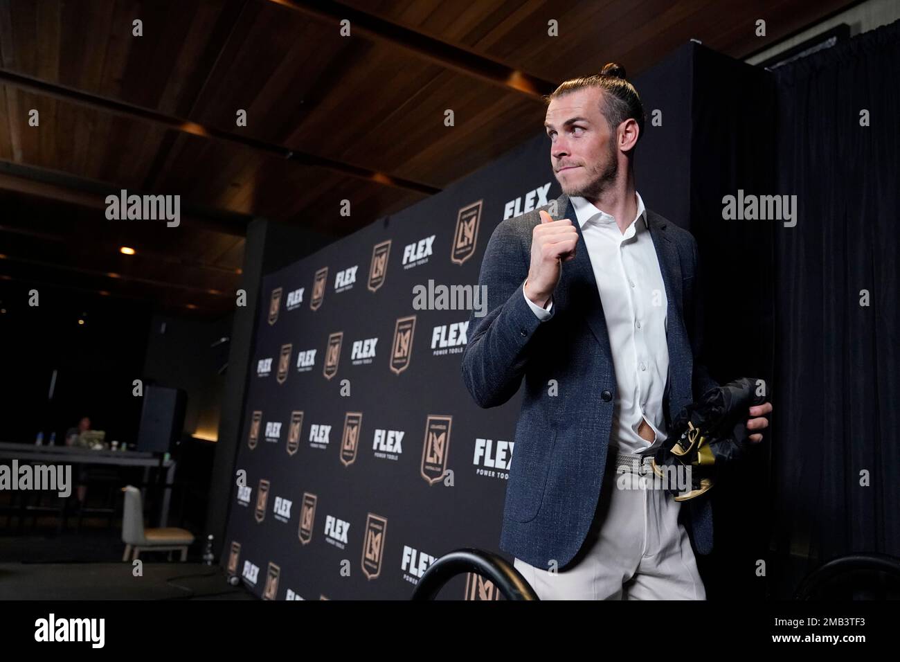 Gareth Bale gestures as he walks off the stage after being introduced as a  new member of the Los Angeles FC MLS soccer club Monday, July 11, 2022, in  Los Angeles. (AP