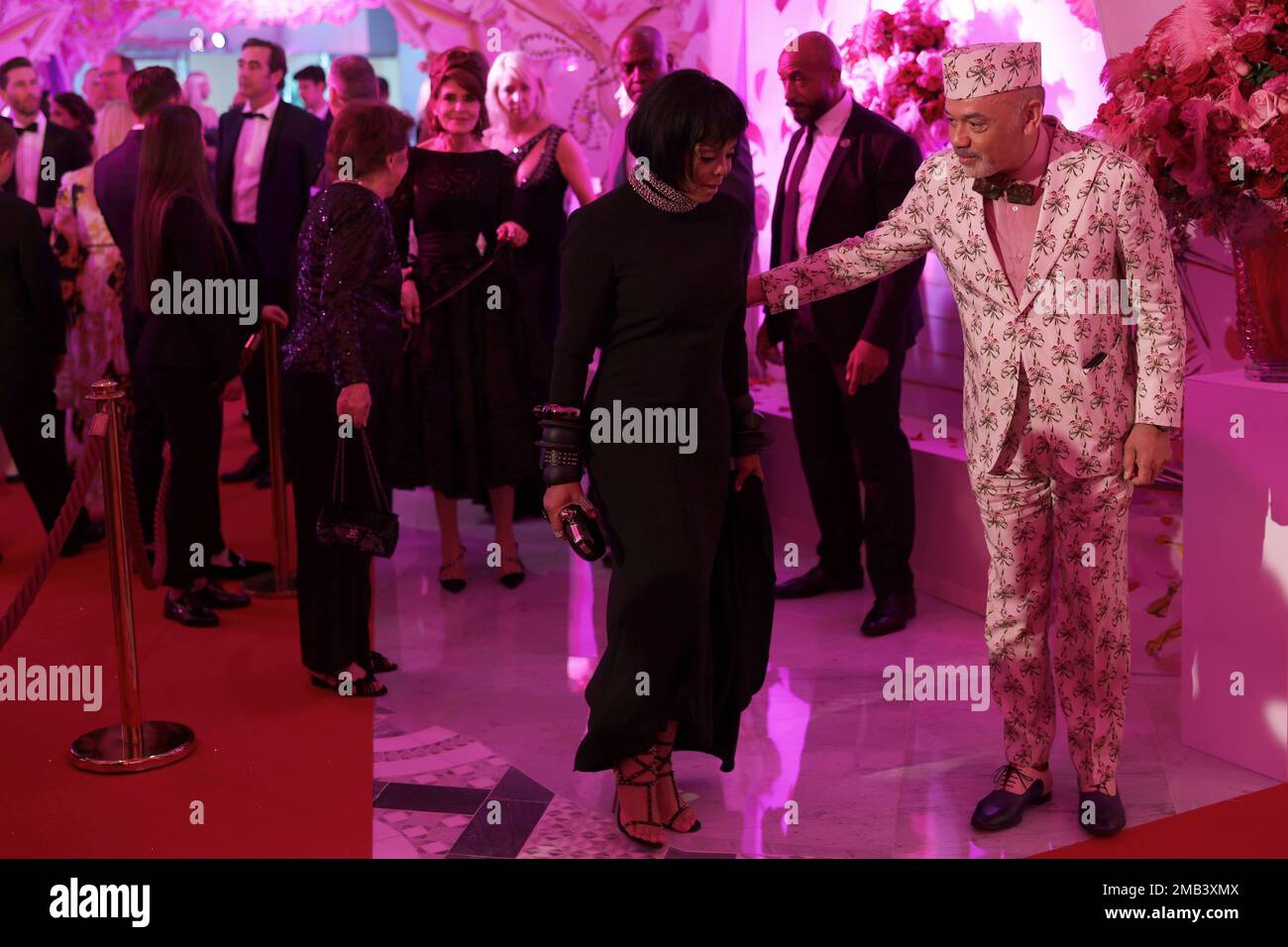 US singer Jackson (2ndR) and French designer Christian Louboutin