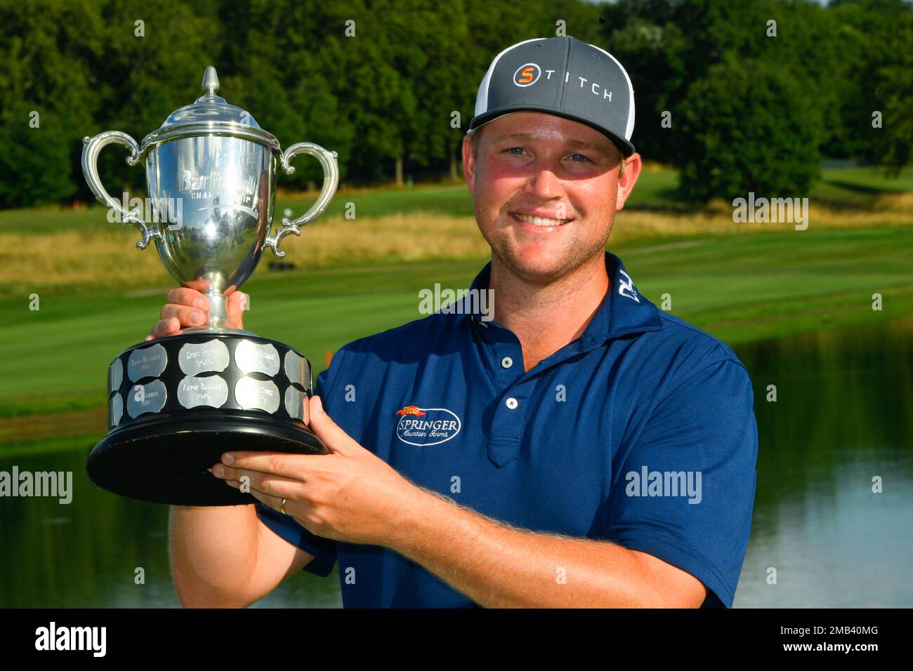 Trey Mullinax holds the trophy after winning the Barbasol Championship ...