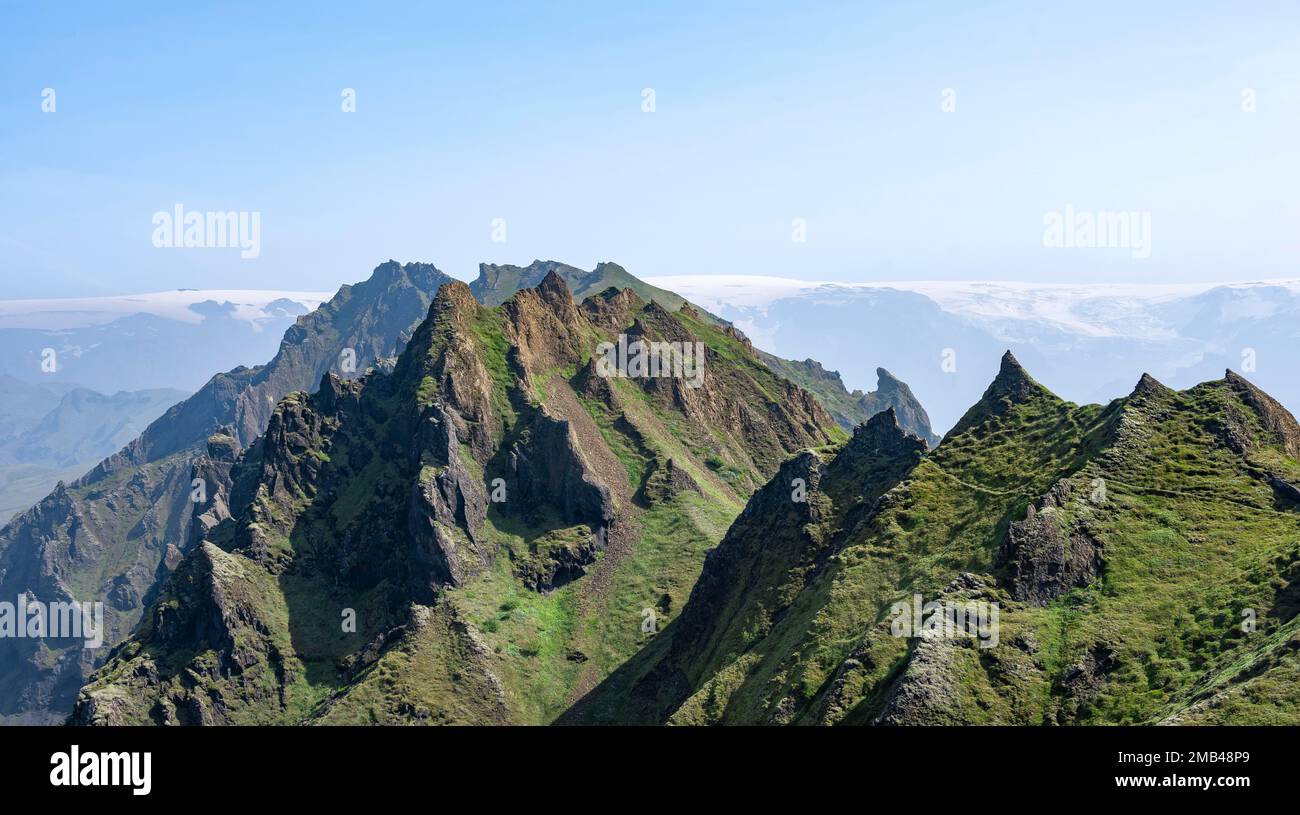 Pointed Ridge Pointed green mountain peaks on the ridge of Tindfjoell, Myrdalsjoekull ...
