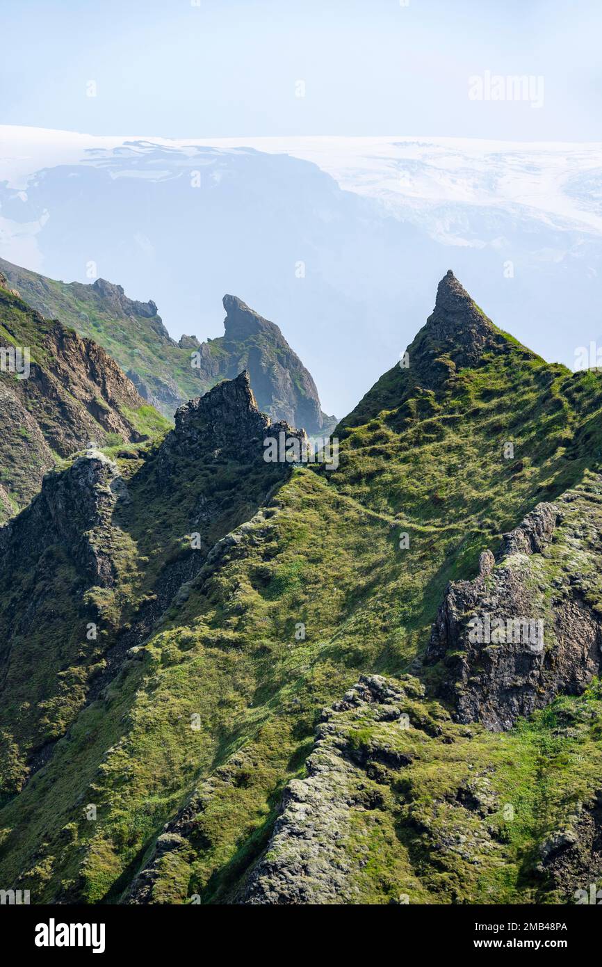 Pointed Ridge Pointed green mountain peaks on the ridge of Tindfjoell, Myrdalsjoekull ...