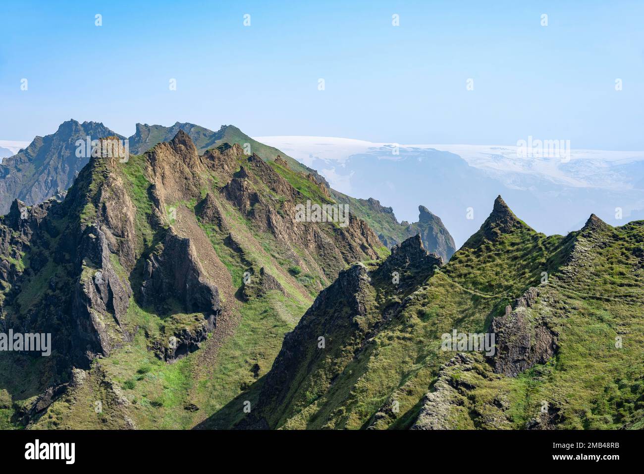 Pointed Ridge Pointed green mountain peaks on the ridge of Tindfjoell, Myrdalsjoekull ...