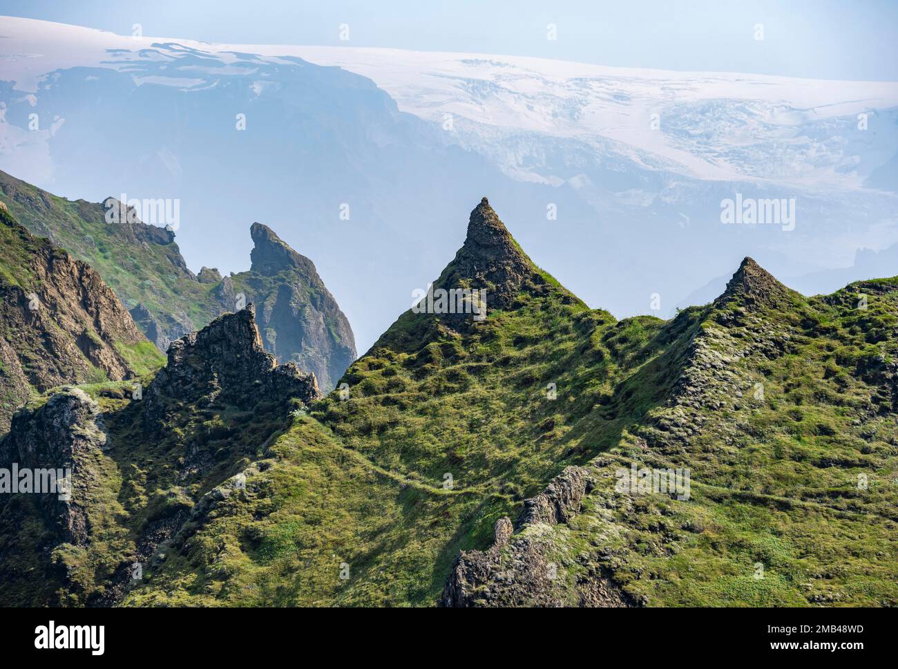 Pointed Ridge Pointed green mountain peaks on the ridge of Tindfjoell, Myrdalsjoekull ...