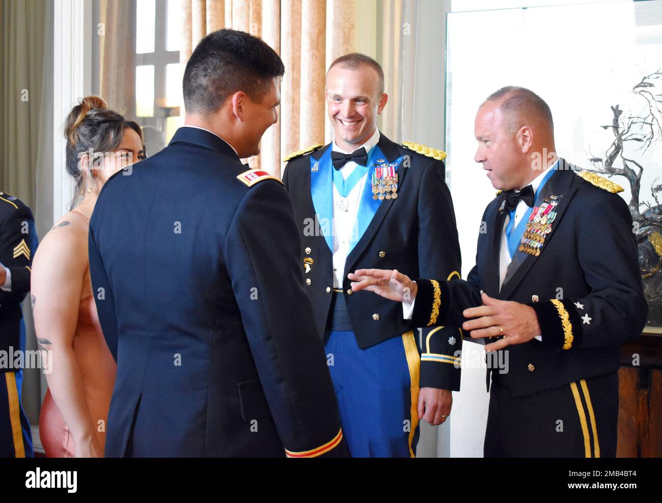 Maj. Gen. Anthony Hale, right, commanding general of the Army Intelligence Center of Excellence and Fort Huachuca, and Lt. Col. Matthew Upperman, commander of the 229th Military Intelligence Battalion, greet guests at the battalion’s Army Birthday Ball at the Naval Postgraduate School, Monterey, Calif., June 11, 2022. Stock Photo