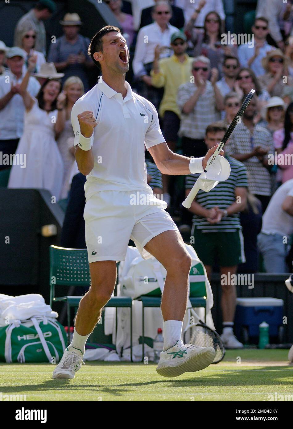 Serbias Novak Djokovic celebrates after beating Britains Cameron Norrie in a mens singles semifinal on day twelve of the Wimbledon tennis championships in London, Friday, July 8, 2022