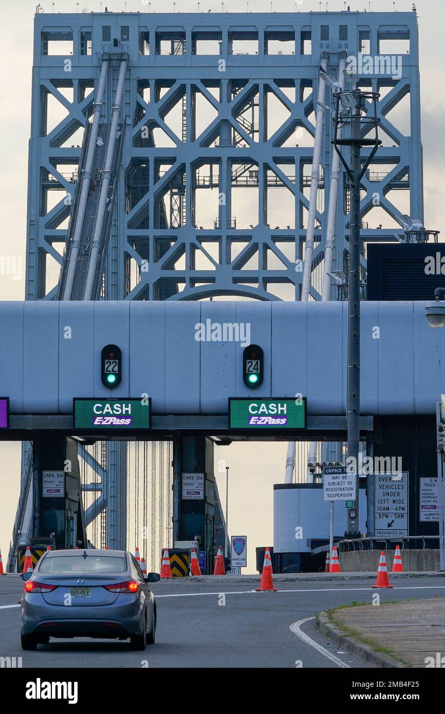 Cars pass through toll booths to use the Washington Bridge in