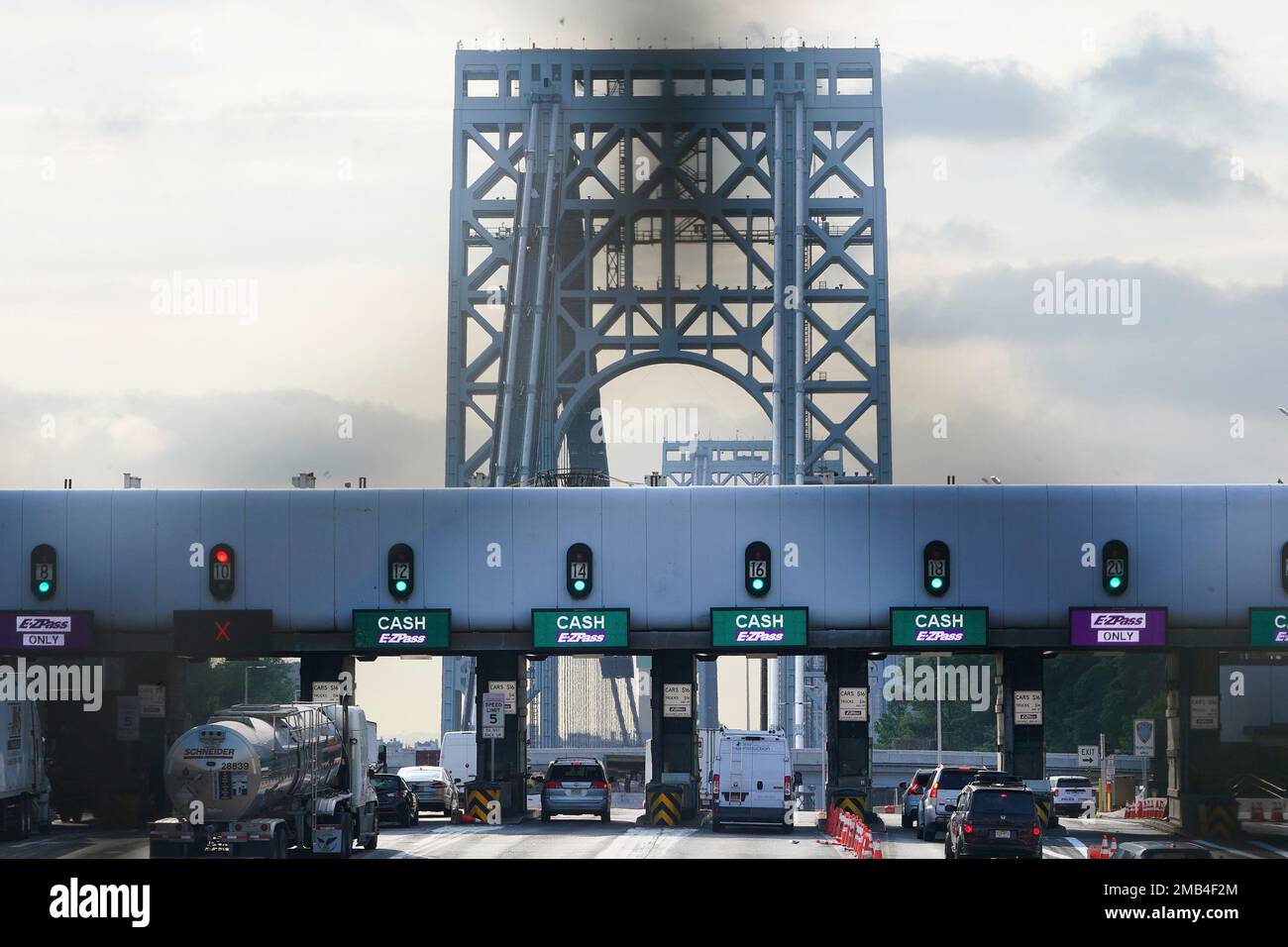 Cars pass through toll booths to use the Washington Bridge in