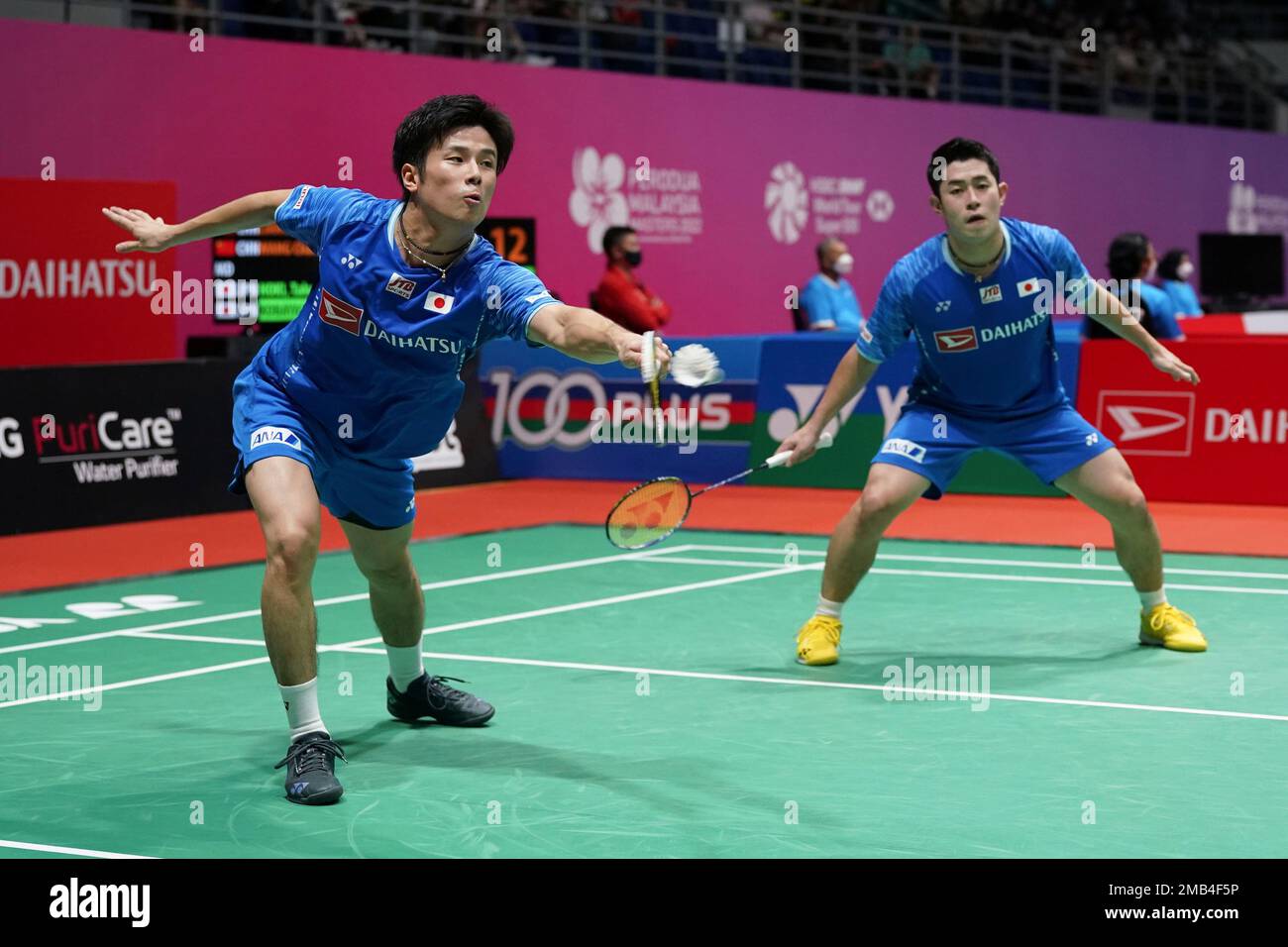 Japan's Yugo Kobayashi, left, and Takuro Hoki plays a shot against